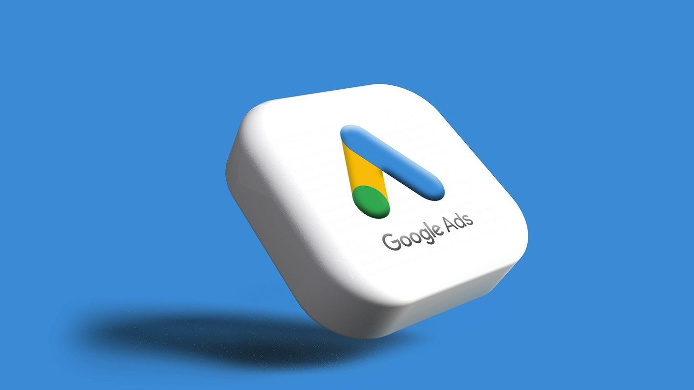 a white google logo on a blue background