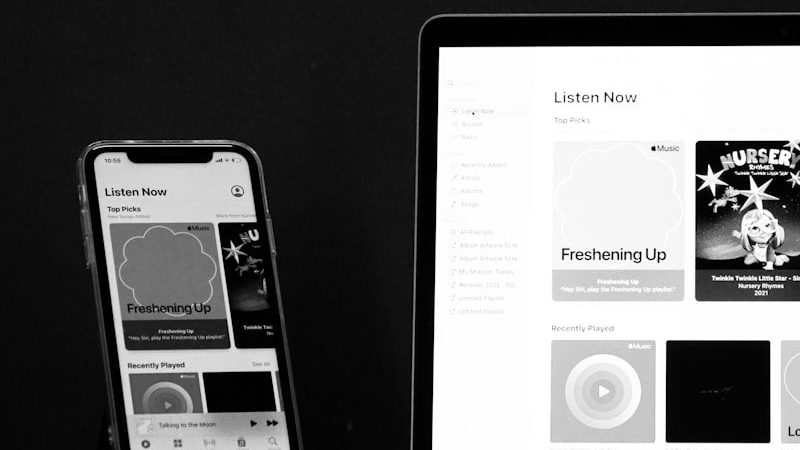 a laptop computer sitting on top of a wooden desk